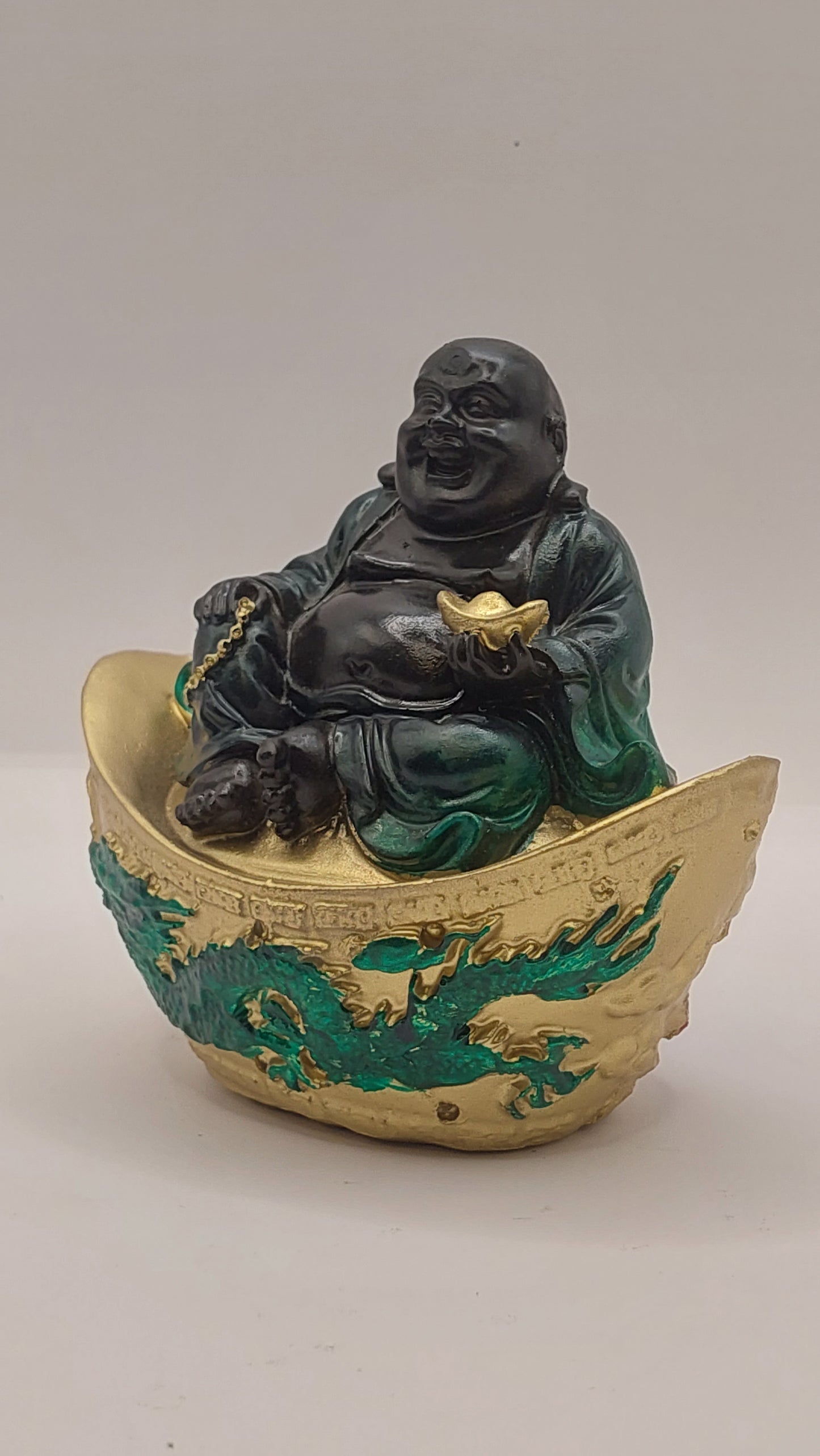 Buda Hotei sobre Lingote