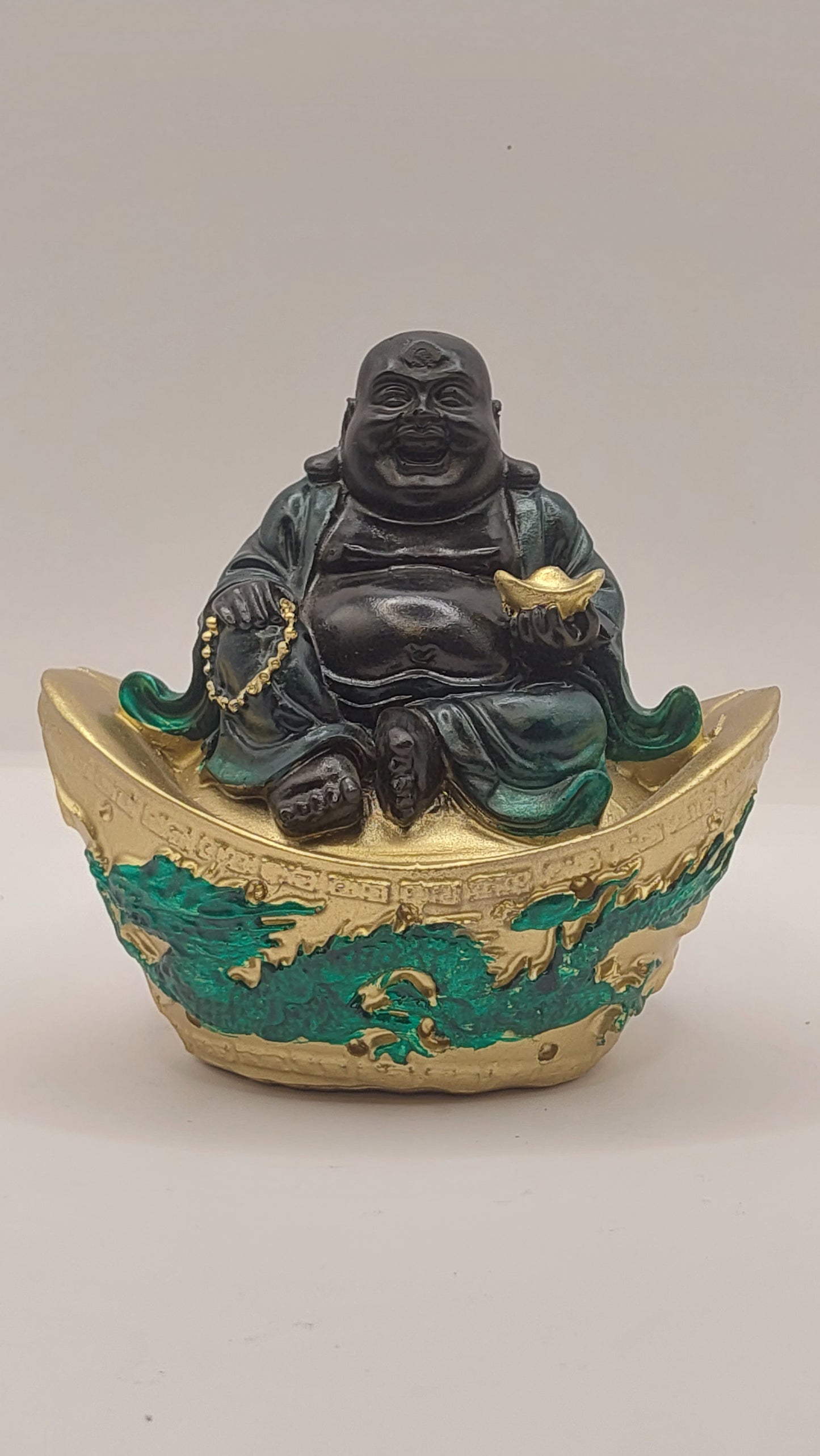 Buda Hotei sobre Lingote